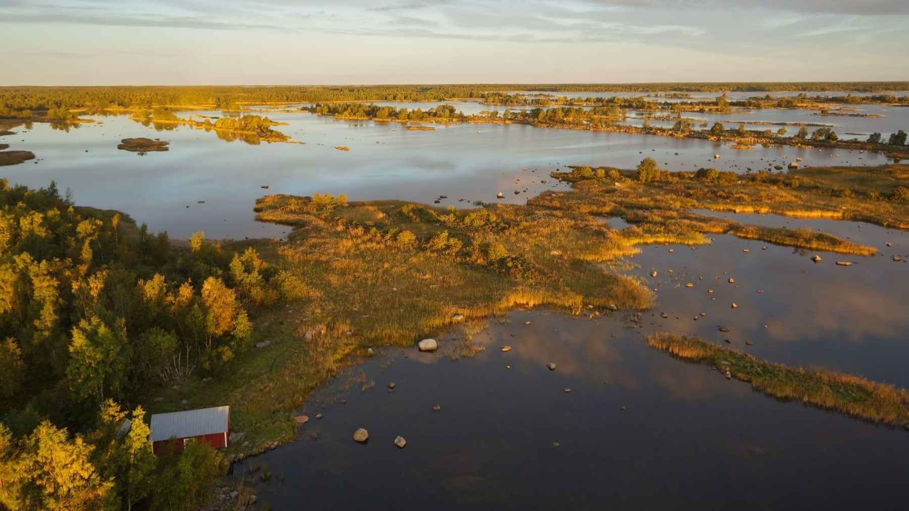 Aerial view of shallow waterways, rocky islets, and wetlands in Finland’s Kvarken Archipelago