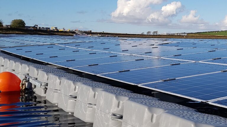 Rows of floating solar panels on a reservoir near London