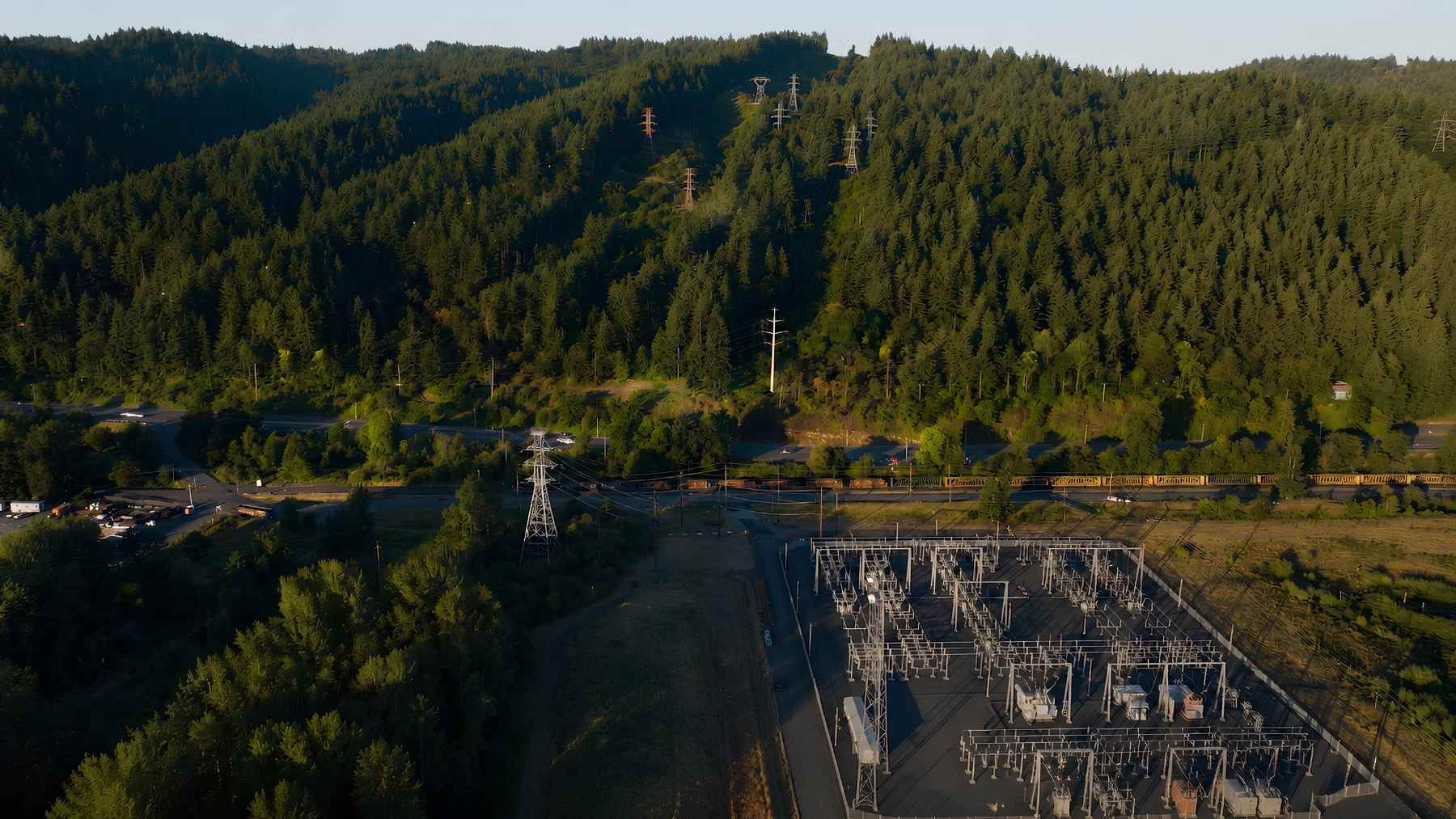 Aerial view of the Harborton Substation and transmission corridor beside Forest Park in Portland, Oregon.