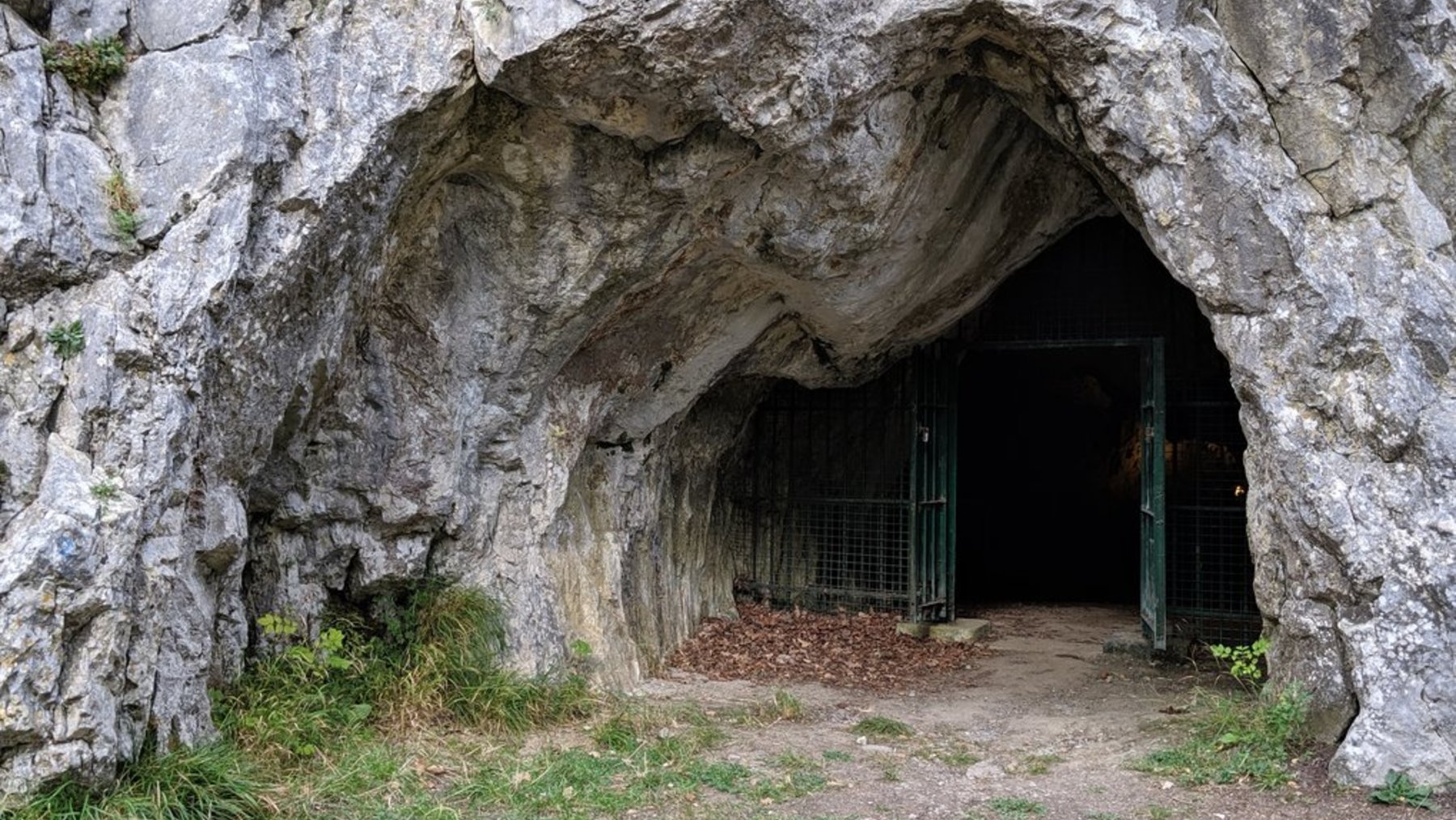 Entrance to the Goyet Caves in Belgium, a limestone cave with a metal gate
