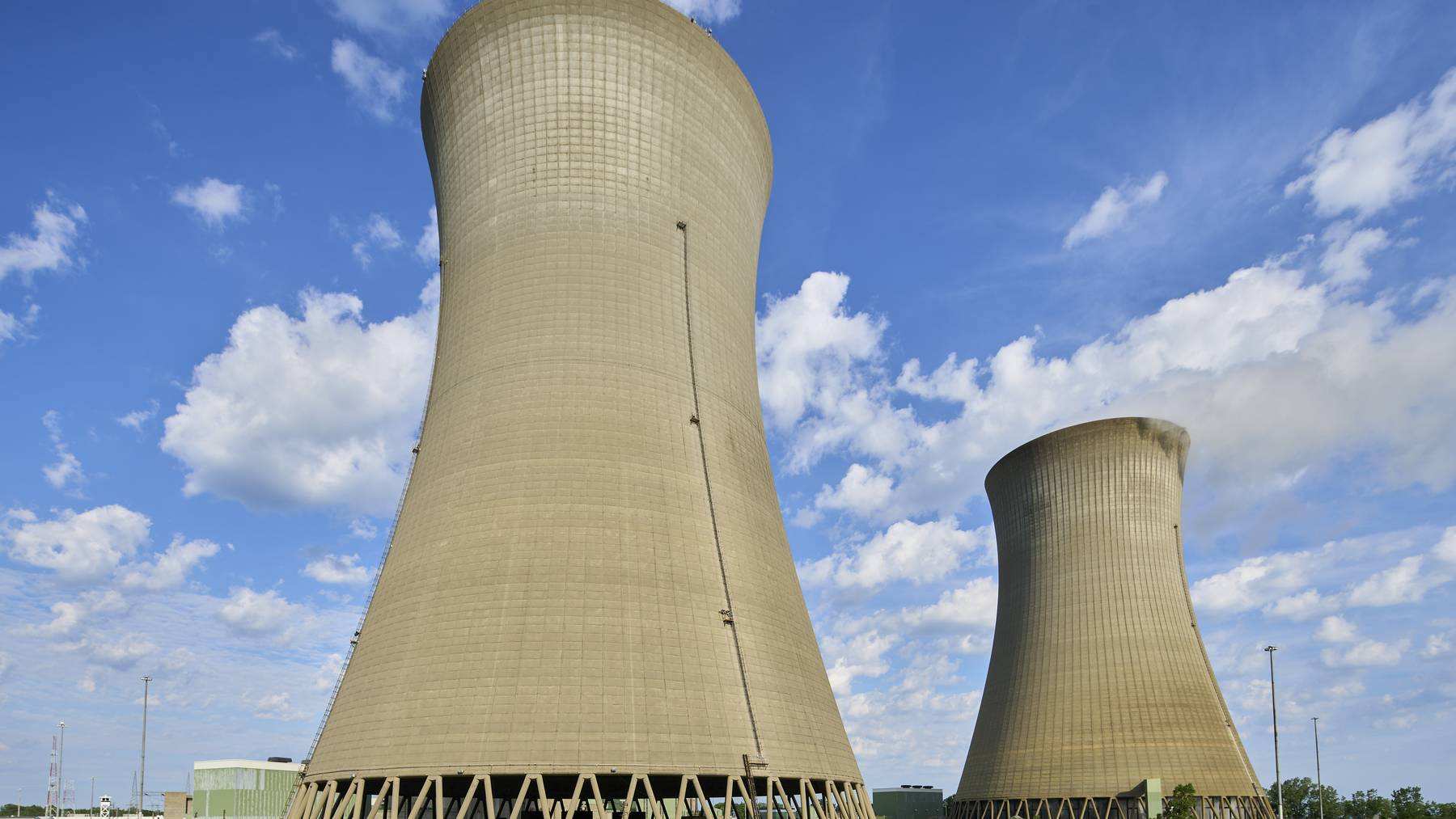 Two large cooling towers rise above the Perry Nuclear Power Plant on Lake Erie in Ohio.