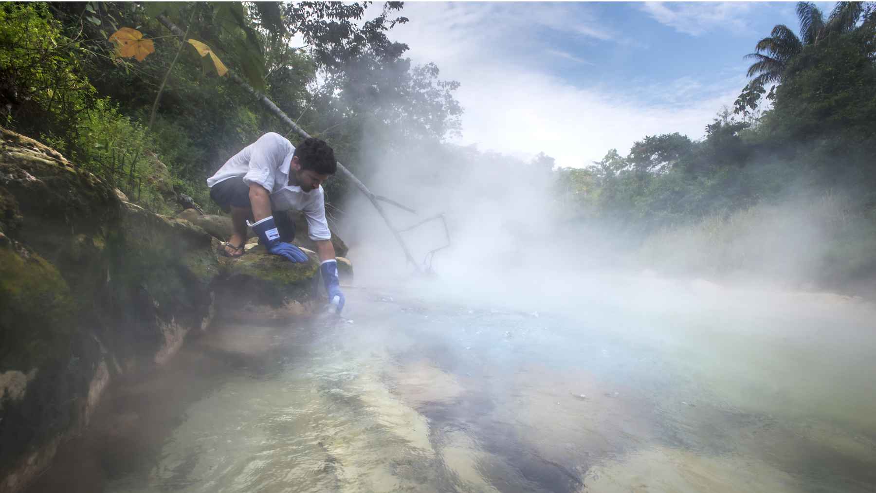 Researcher working beside the steaming Boiling River in the Peruvian Amazon.