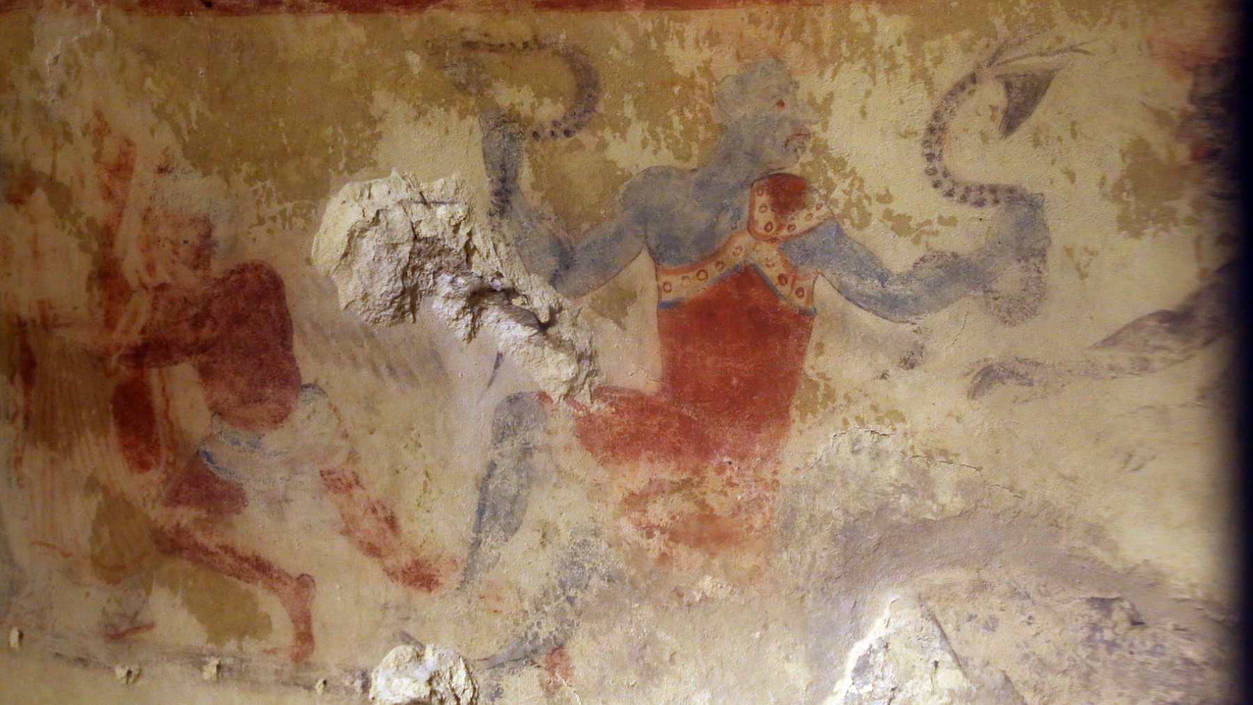 Painted underworld figure on a wall of the Etruscan Tomb of the Blue Demons in Tarquinia, Italy
