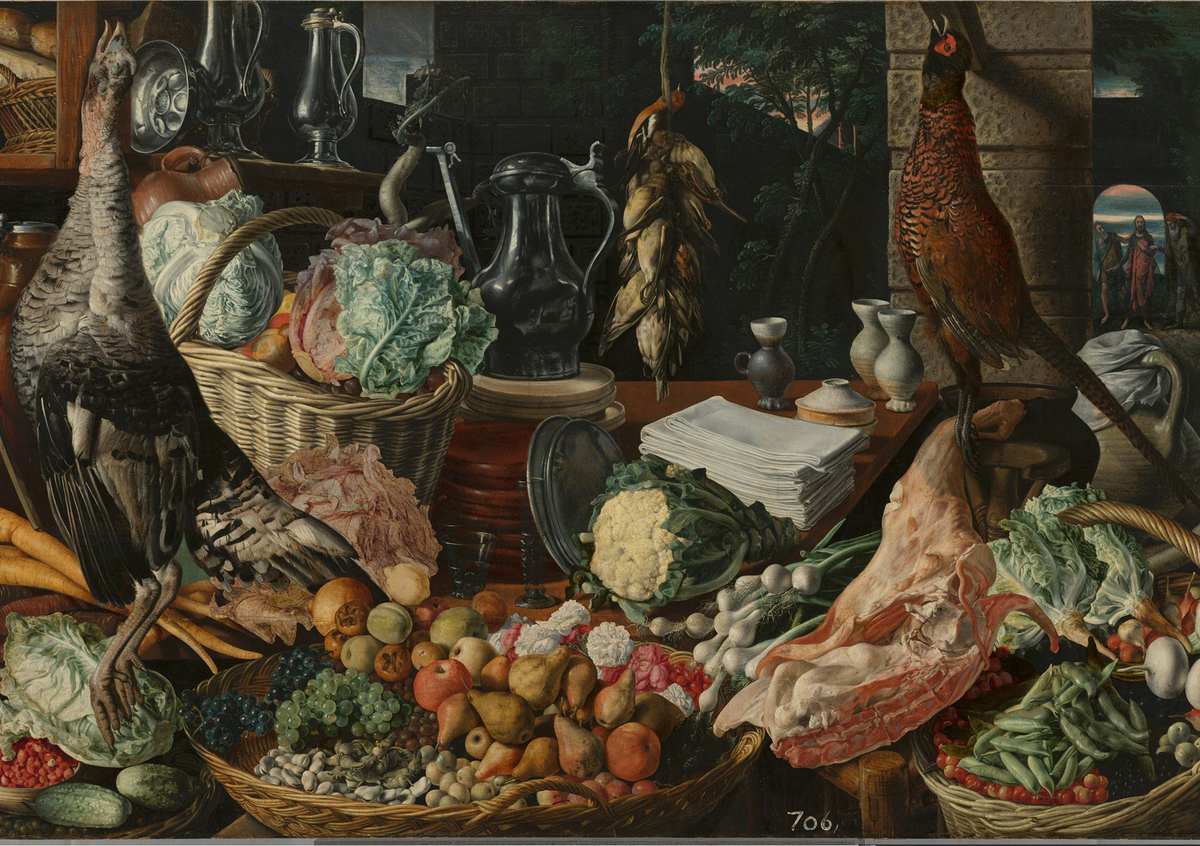 Sixteenth-century kitchen painting by Joachim Beuckelaer crowded with cabbages, root vegetables, fruit baskets and game