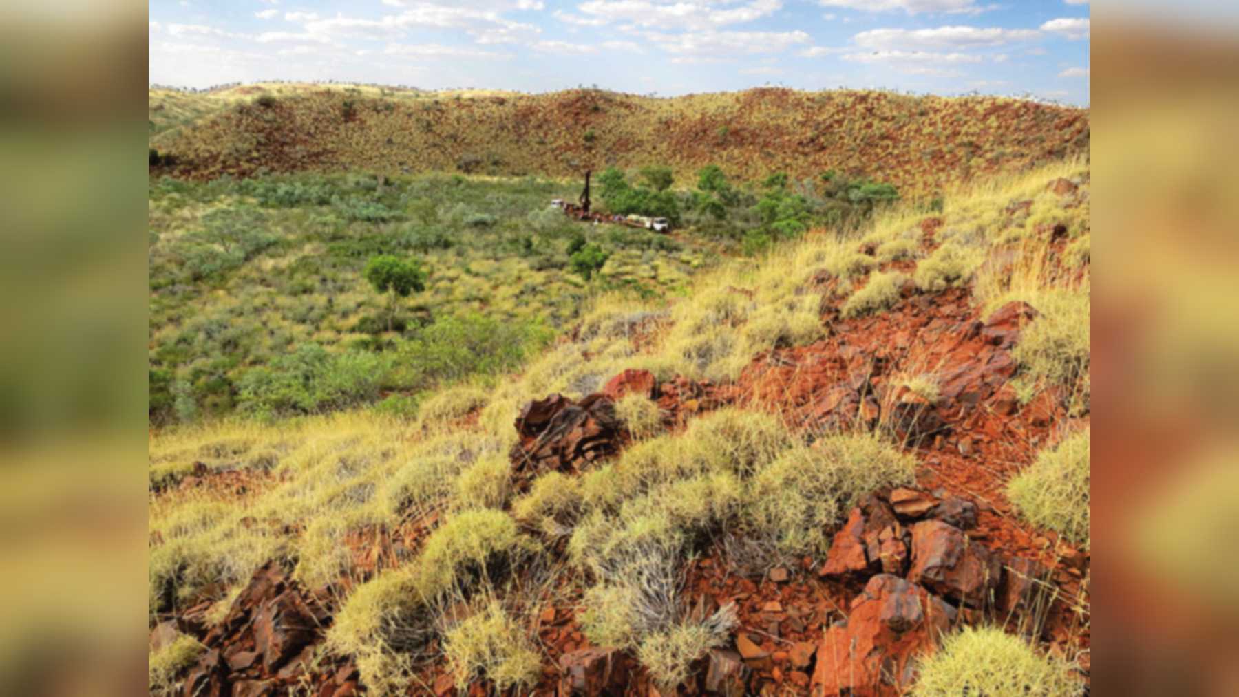 Diamond drill rig on the floor of Hickman Crater in Western Australia, seen from the south rim
