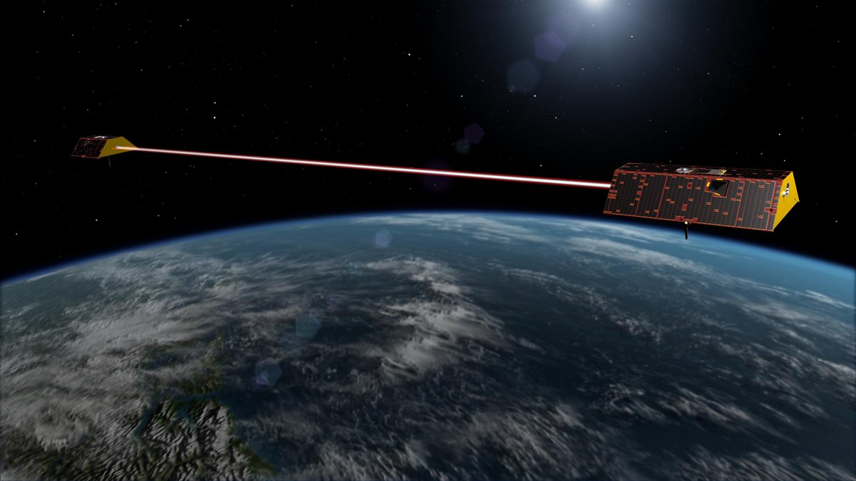 Artist's illustration of NASA's twin GRACE Follow-On satellites linked by a laser beam in orbit above Earth