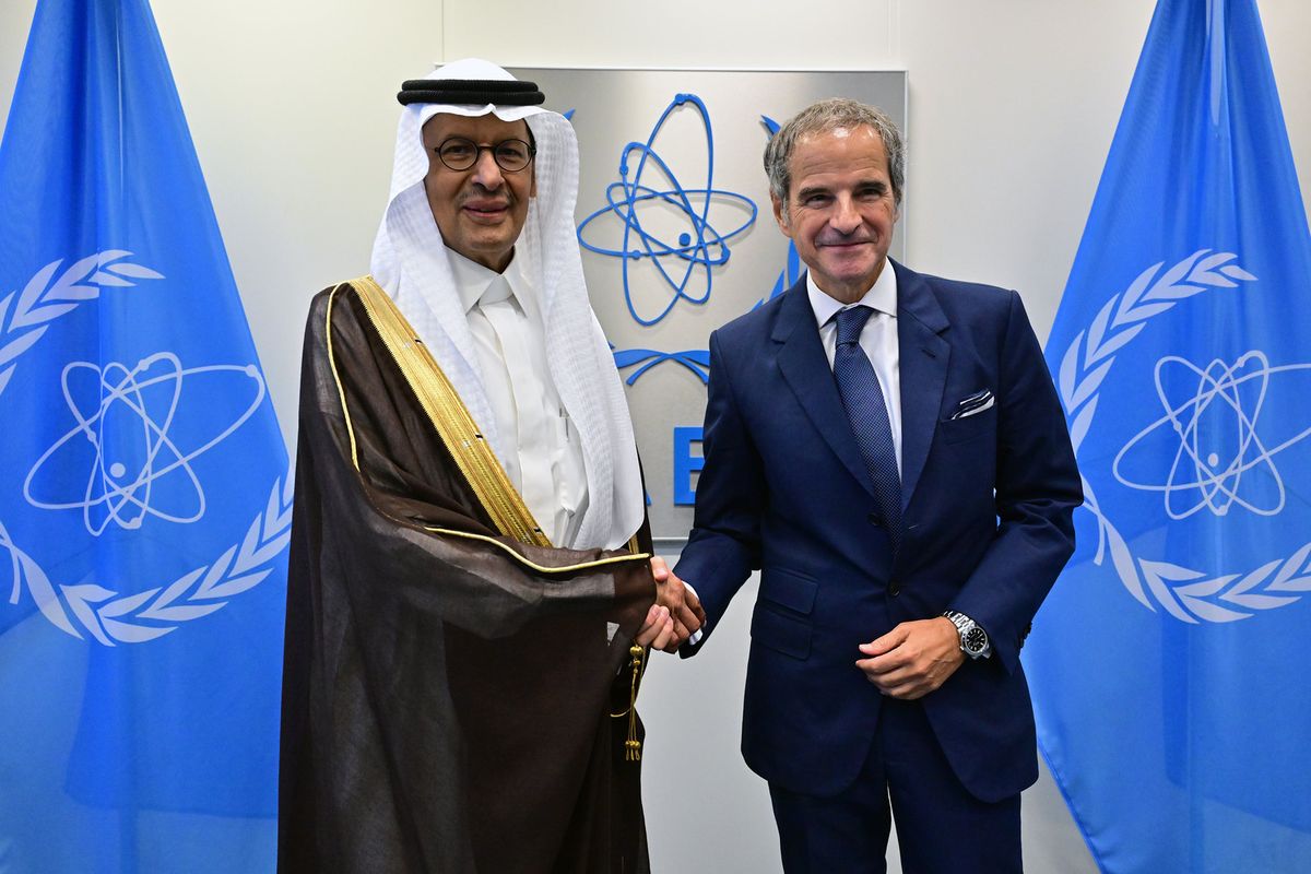 IAEA Director General Rafael Mariano Grossi shakes hands with Saudi Energy Minister Prince Abdulaziz bin Salman in Vienna