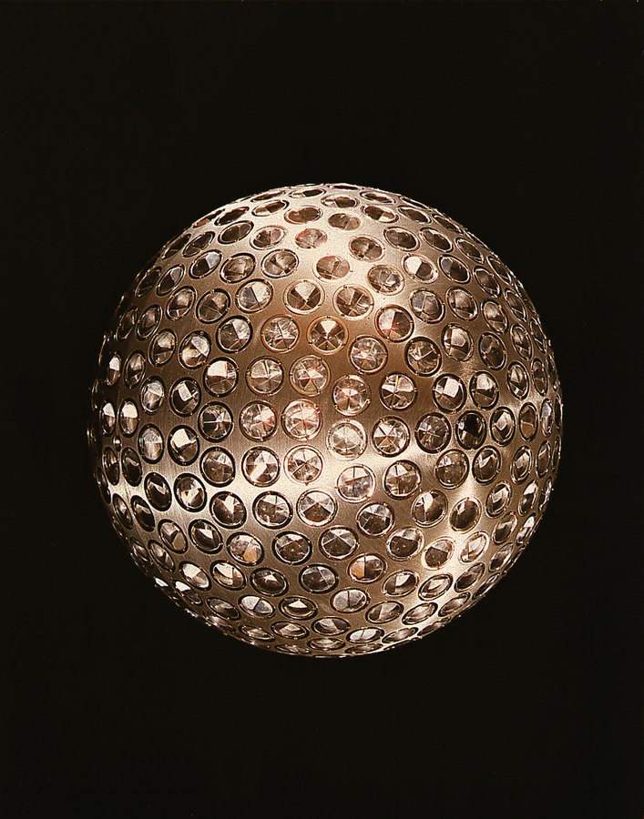 The LAGEOS laser geodynamics satellite, a two-foot sphere covered in reflectors used to track Earth's center of mass with lasers