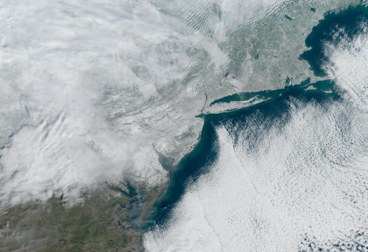 Satellite view of snow on the ground across the northeastern United States on December 15, 2025