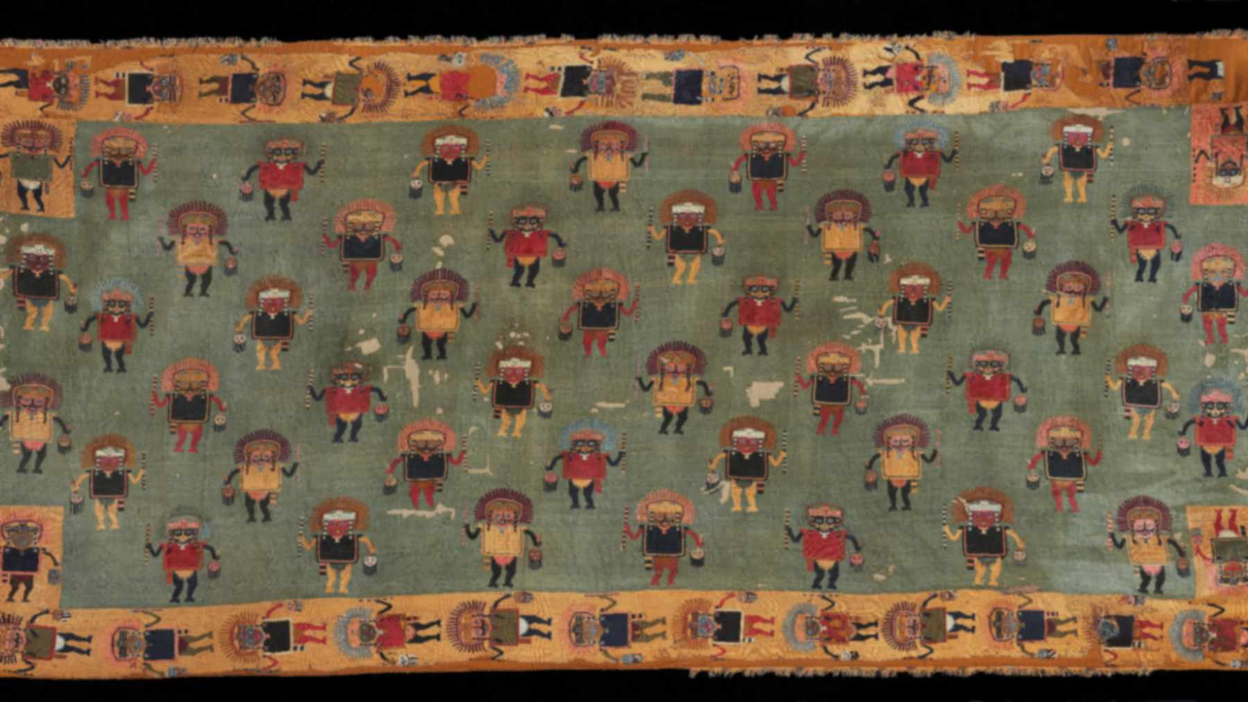 Detail of a Paracas ceremonial mantle with rows of embroidered figures