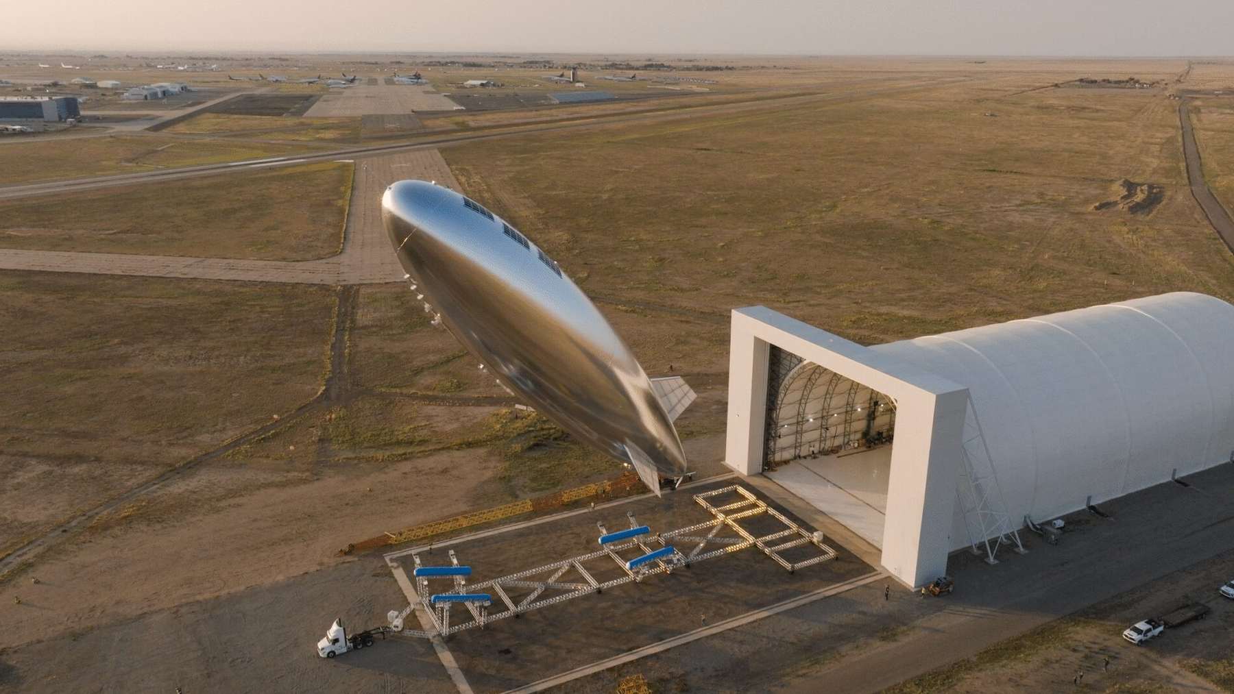 Sceye's ST1 stratospheric airship rising beside its hangar in New Mexico at the start of the flight to Japan