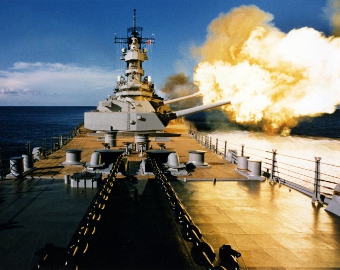 Battleship Wisconsin firing a broadside to port with its 16-inch and 5-inch guns, circa 1988-91