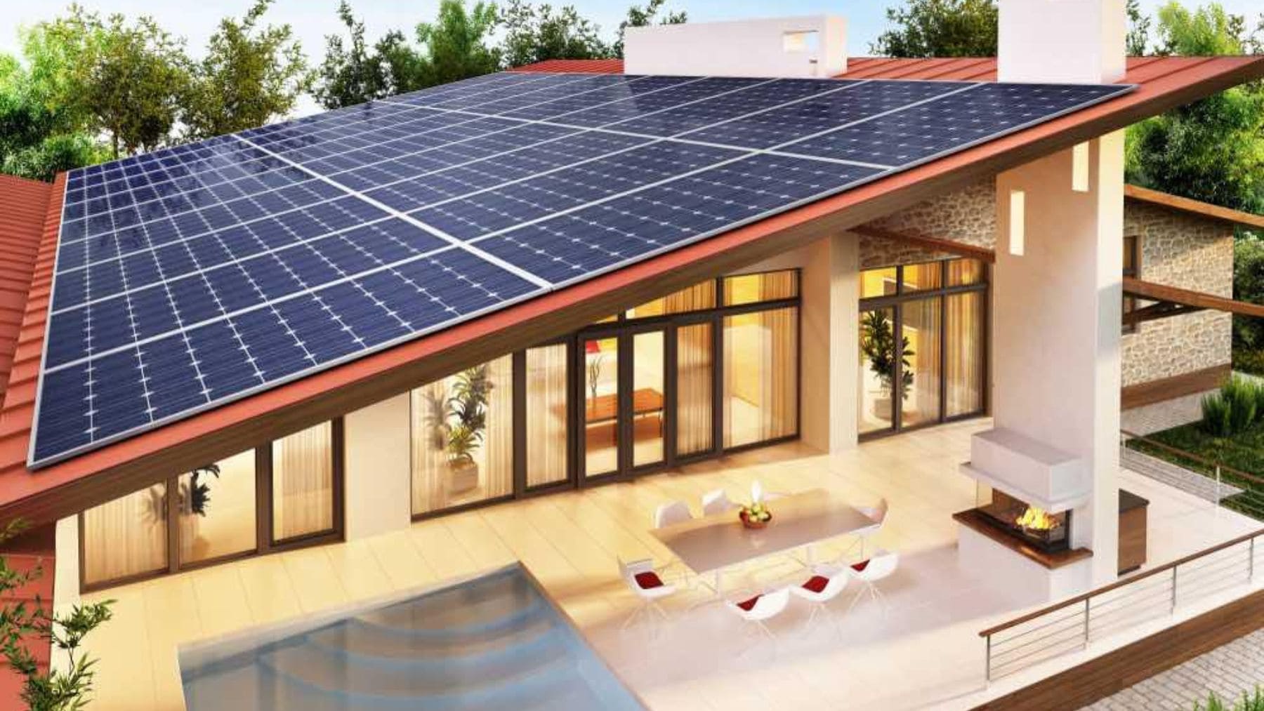 Casa con paneles solares en el tejado durante el día, ejemplo de instalación doméstica de autoconsumo energético.