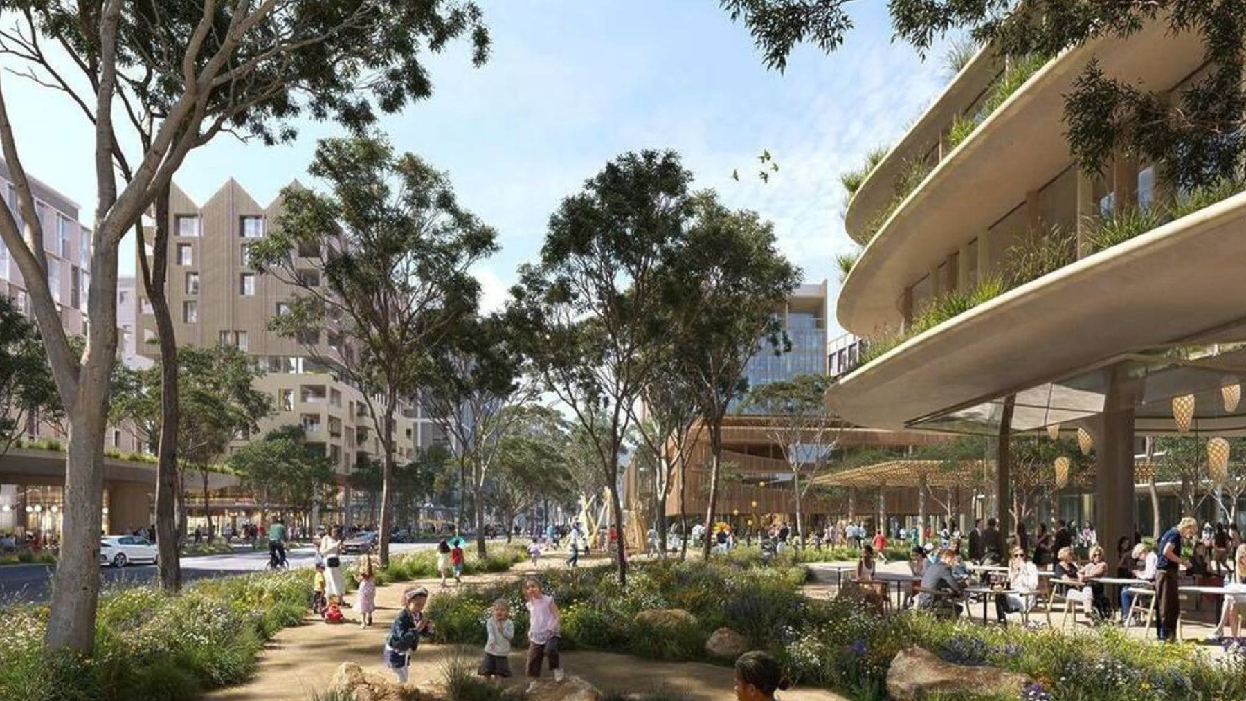 Vista de Bradfield, nueva ciudad sostenible en Australia con zonas verdes, edificios modernos y espacios peatonales.