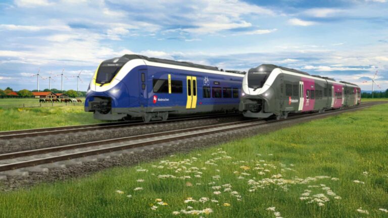 Recreación de dos trenes de batería Mireo Plus B de Siemens con el logotipo de Niedersachsen junto a un prado con aerogeneradores