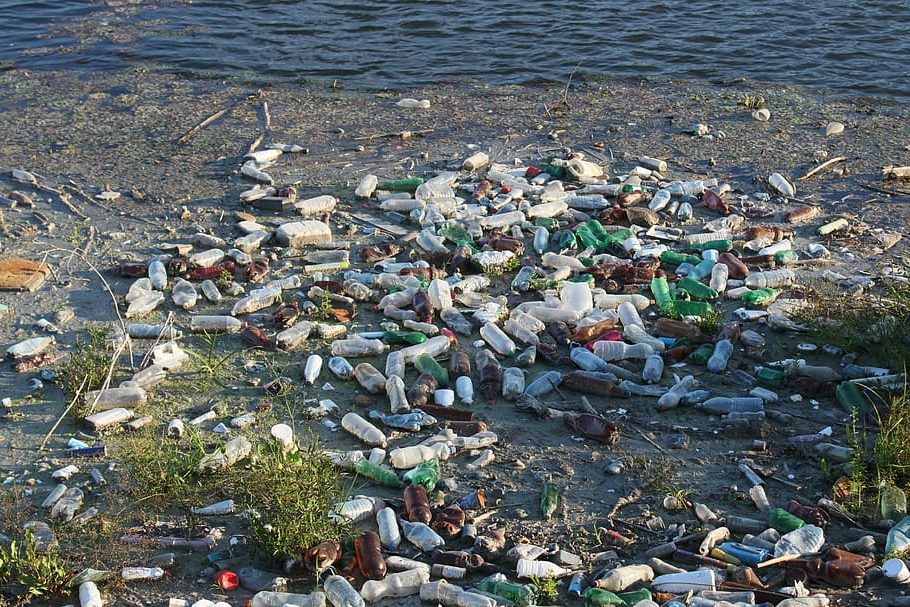 bottles dump floating garbage e1654687757625