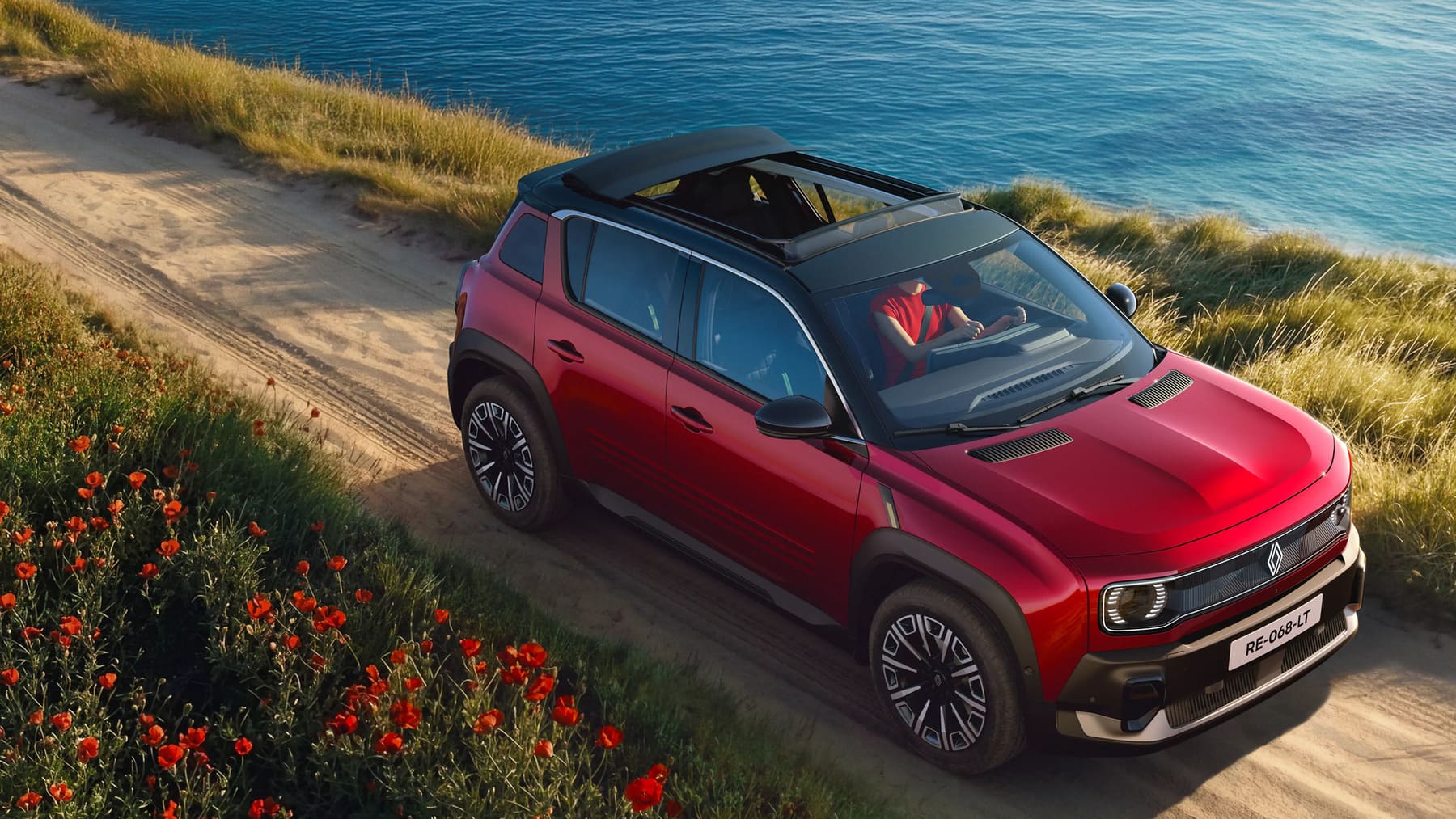 Renault 4 E-Tech eléctrico con techo solar de lona abierto circulando